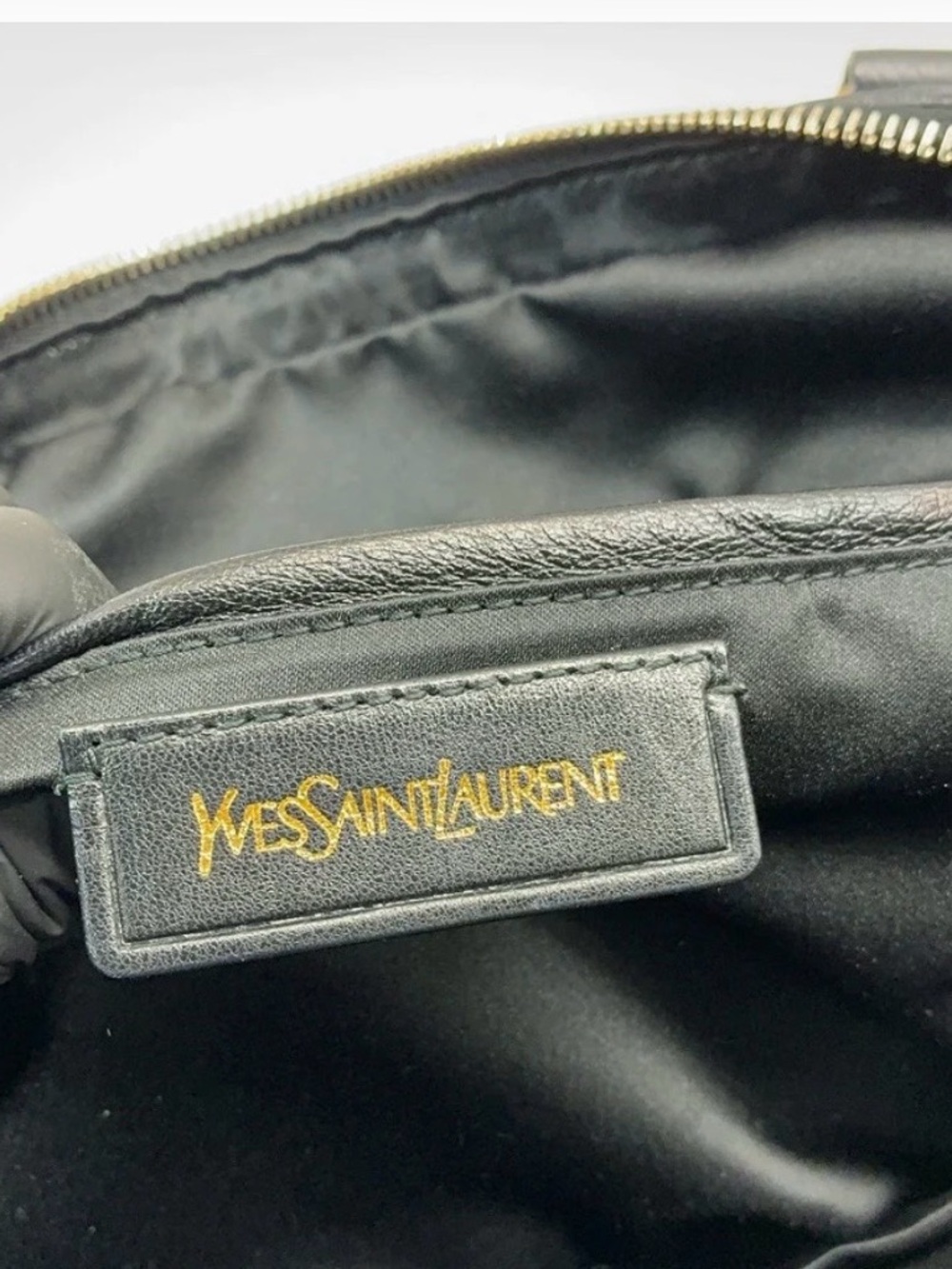 Yves Saint Laurent Black Leather Interior with Gold Logo Tag